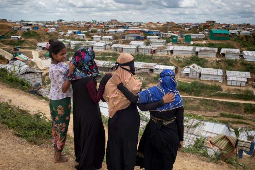 Girls standing together overlooking the Bangladesh refugee camp