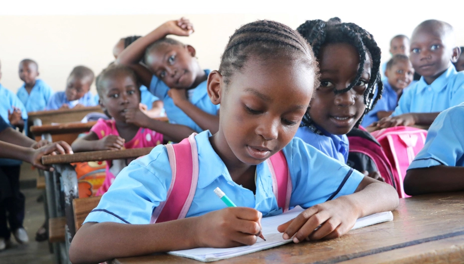 Girl learning in newly refurbished classroom in Beira