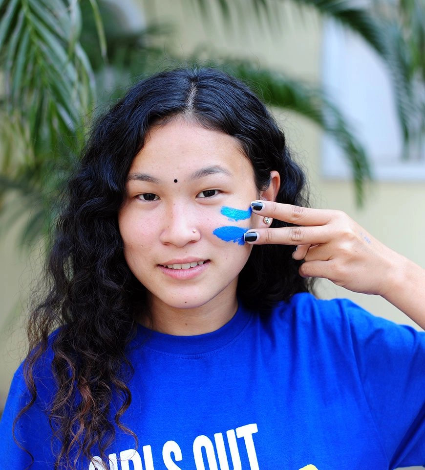 Sabita paints equal sign on her face to show her support for gender equality