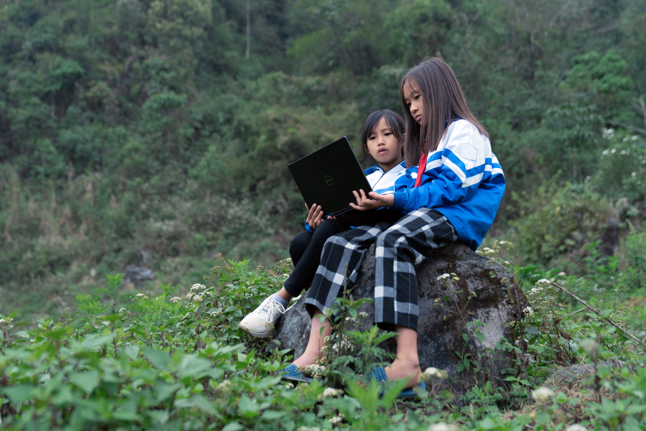 Girls use computer to access online training in Lai Châu Province