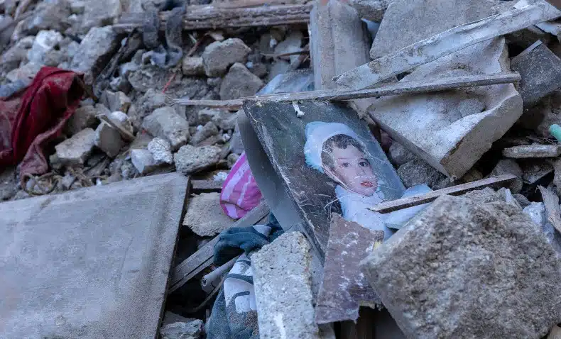 Child's photo amid rubble of destroyed building in Aleppo, Syria