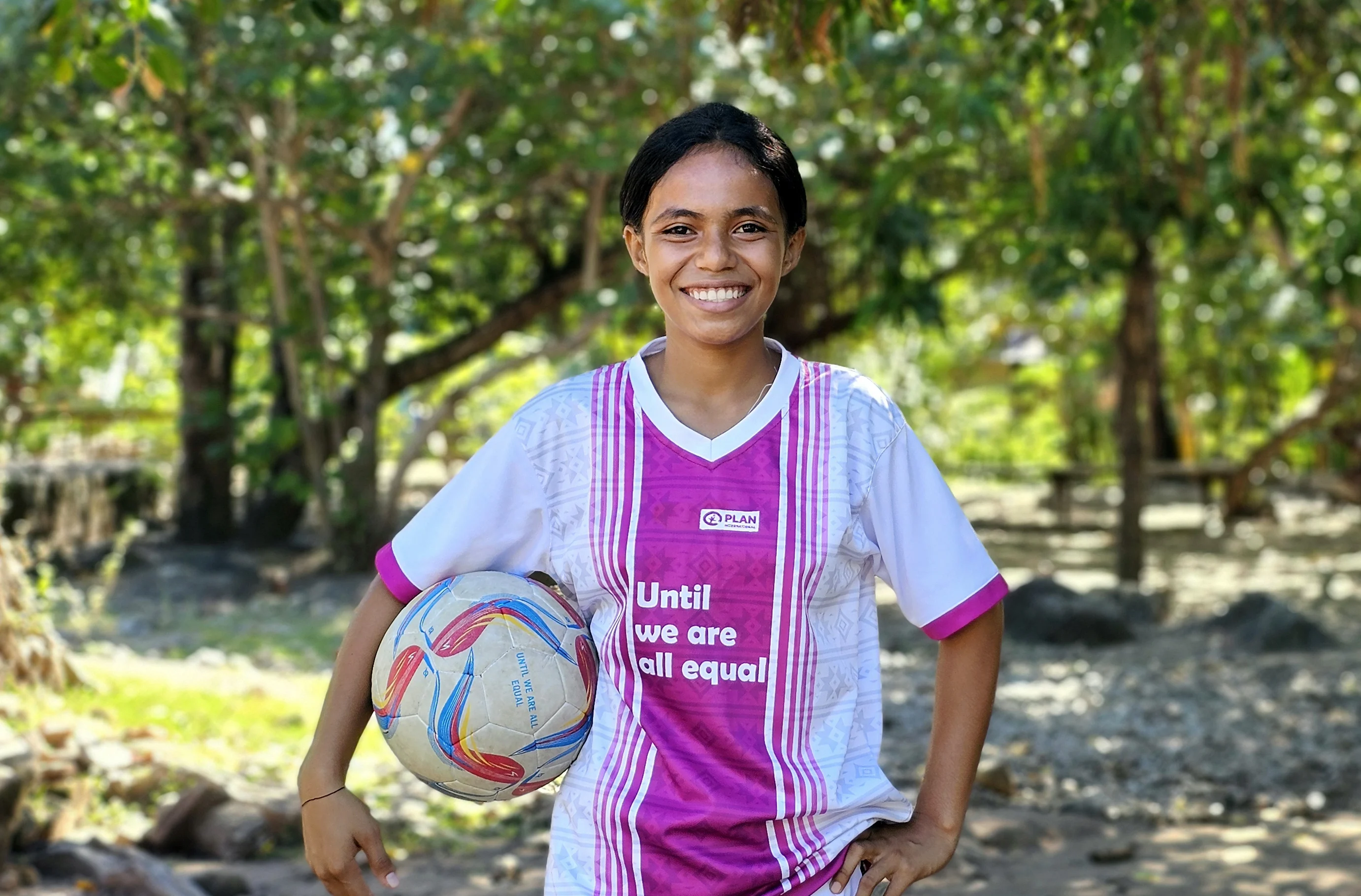 Maria, 14, says that playing football makes her happy
