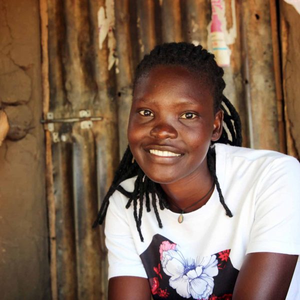 Ruth didn’t want to drop out of school, but the 20-year-old refugee from South Sudan says she had no choice when she couldn’t afford the fees. “After I left school, I was at home, and life became very hard.”

The settlement where she lives, in the Adjumani district in the north of Uganda, is now home to some 15,000 people (including those who live in the host community). Uganda is the largest refugee host country in Africa.

Wanted to help her family, Ruth joined a business training programme set up by Plan International as part of our Adolescent Girls in Crisis project. Today, she is the proud owner of a successful small business, selling charcoal, dried fish, tomatoes, scissors, padlocks and dresses – a real corner store.
