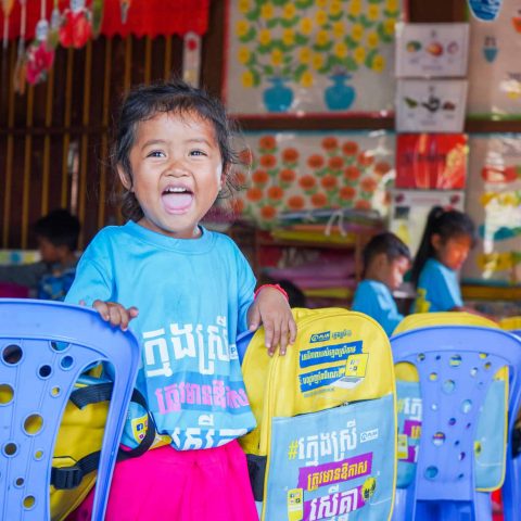 In a dark blue skirt and light blue shirt, Thong Lao sings a song with her 30 young students aged between three and five. While singing, she makes gestures to go along with the lyrics, and the children follow her lead. At the end of the song, they all laugh happily together and its clear that this preschool teacher loves her job and the youngsters in her care. 

After teaching from her home for five years, Plan International and our local partners supported the construction of a new community preschool building and equipped it with furniture, learning, and teaching materials for the children. Through a collaboration with the Ministry of Education, Youth and Sport, further training was provided training to Thong Lao. "I am happy as we have a new school full of materials," she says.

With support from Plan International, awareness raising was conducted in the village to encourage parents to send their children to the new preschool. "When I see so many children in my class, it motivates me to find better ways to teach them," says Thong Lao, adding that she also wants to show parents that their trust in her is not misplaced.