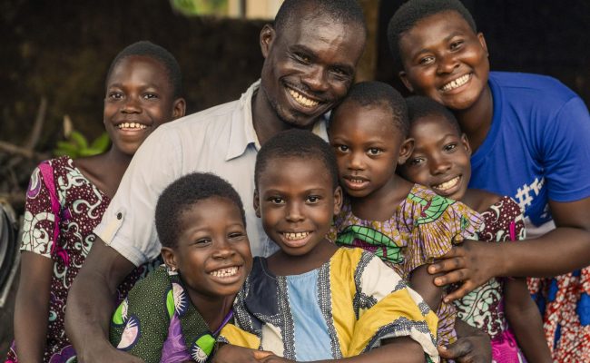 In a small rural community in Ghana’s Oti Region, a quiet revolution is underway. The ‘Real Fathers' Club’ is encouraging men to challenge macho stereotypes by sharing household chores and caring for their children, as well as eradicating harmful practices such as FGM. The club is not just transforming households, but reshaping cultural expectations - proving that real change begins with real men.

Michael, 41, is a teacher, farmer, and father of eight including six daughters. As a member of the Real Fathers' Club, established by Plan International in 2024, he is now a keen advocate of girls’ rights along with the other men of his village. The club provides a platform for men to discuss and redefine masculinity. Thanks to the club’s activities, Michael now shares household responsibilities with his wife and has developed a deeper bond with his children.