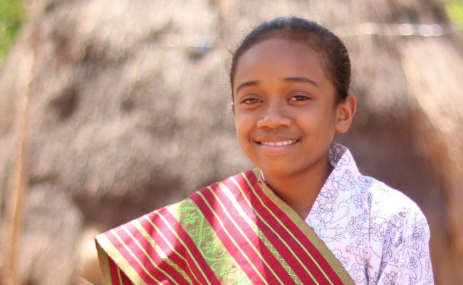 Sari, 12, is able to learn from home due to a radio supplied by Plan International Indonesia